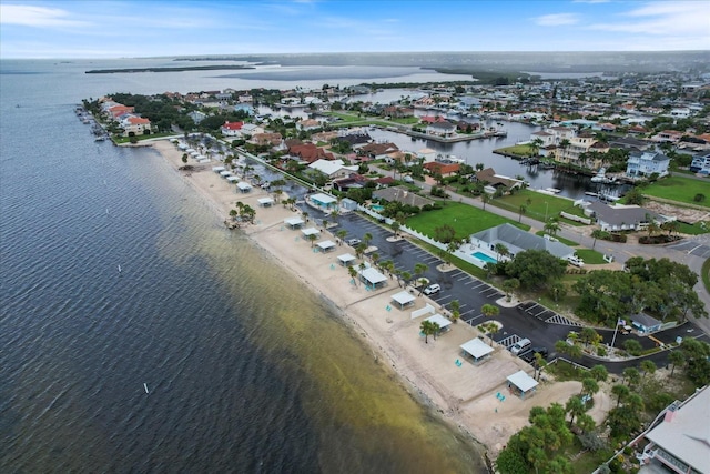 bird's eye view with a view of the beach and a water view