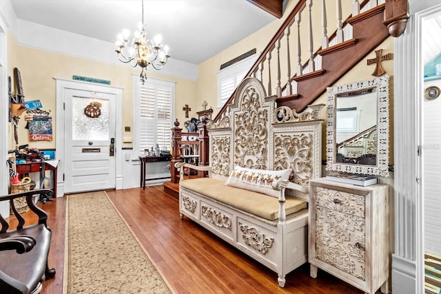 foyer featuring a chandelier and dark hardwood / wood-style flooring