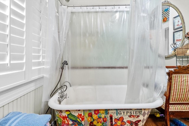 bathroom with a tub to relax in