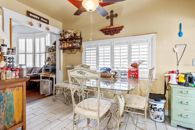 dining area featuring ceiling fan and light hardwood / wood-style floors