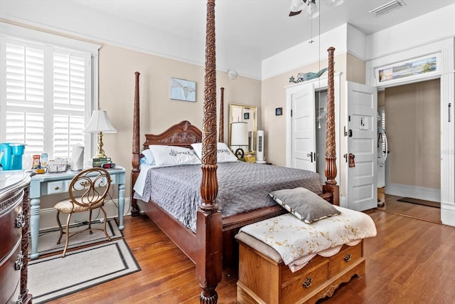 bedroom with light hardwood / wood-style floors and ceiling fan