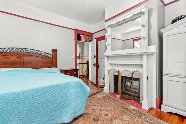 bedroom with hardwood / wood-style flooring