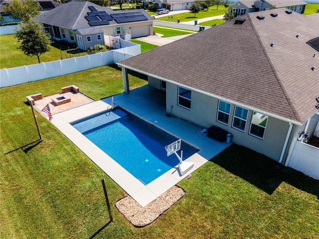 view of pool featuring a yard and a patio