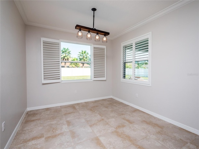 empty room featuring ornamental molding and plenty of natural light