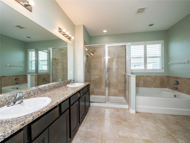 bathroom with vanity, shower with separate bathtub, and tile patterned floors