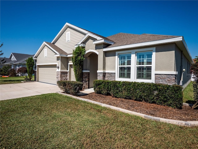 view of front facade featuring a front yard and a garage