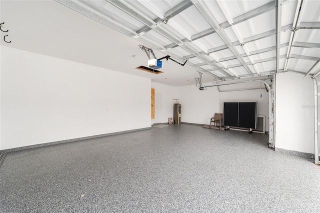 garage featuring a garage door opener and water heater