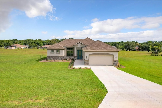 view of front of home featuring a front yard and a garage