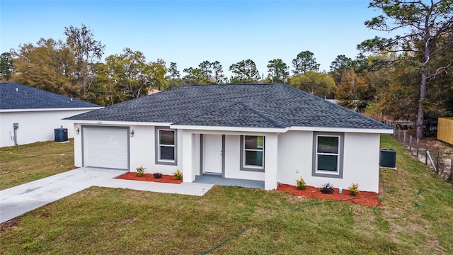 single story home featuring a front yard and a garage