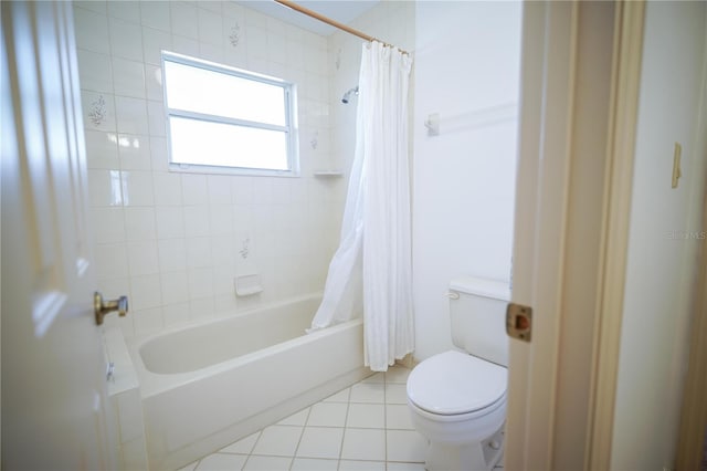 bathroom featuring shower / bathtub combination with curtain, tile patterned flooring, and toilet