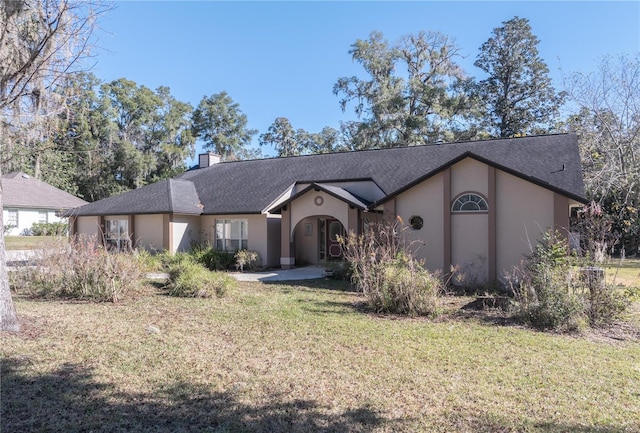 single story home featuring a front yard