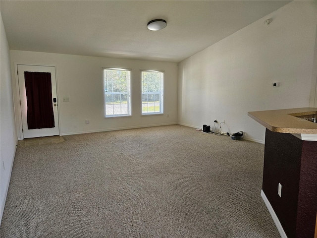 spare room with carpet floors and baseboards
