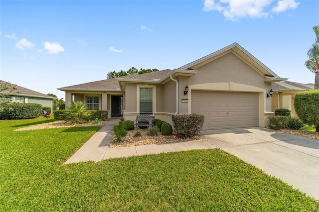 ranch-style house featuring a front lawn and a garage