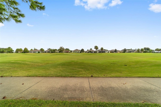 view of home's community with a lawn