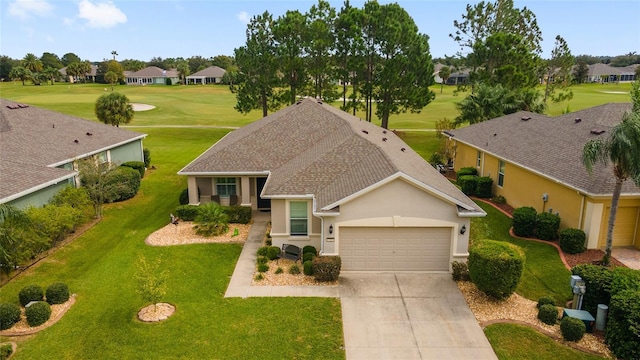 view of front of property with a front lawn, a residential view, concrete driveway, and an attached garage
