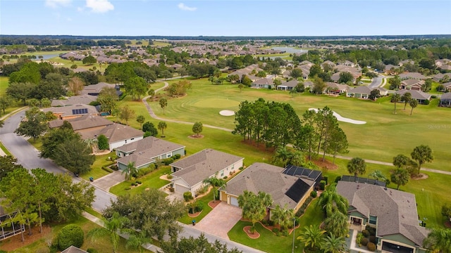 aerial view featuring a residential view, view of golf course, and a water view