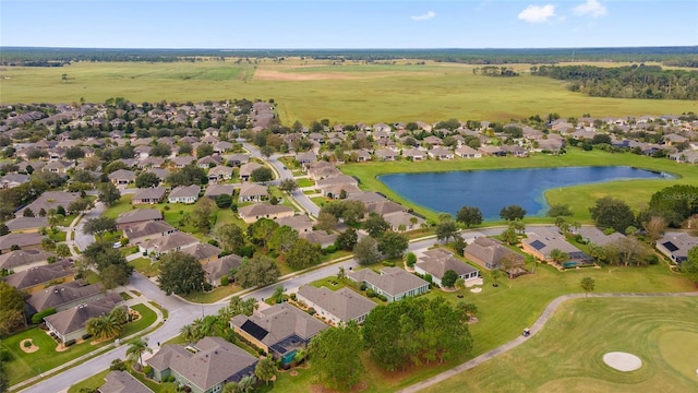 birds eye view of property featuring a residential view and a water view