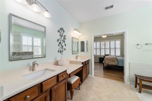 bathroom featuring tile patterned flooring, vanity, plenty of natural light, and ceiling fan