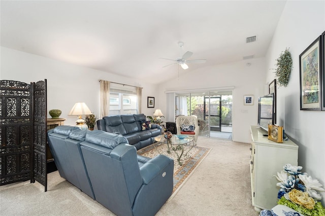 carpeted living room featuring ceiling fan and vaulted ceiling