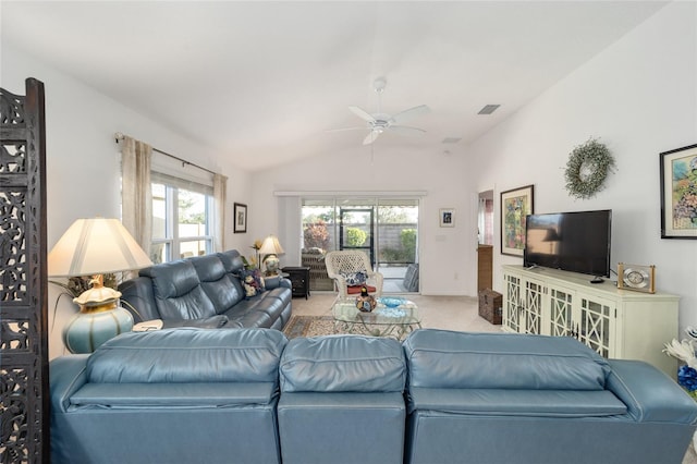 carpeted living room with lofted ceiling and ceiling fan