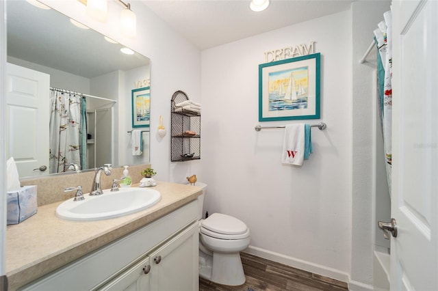 full bathroom featuring wood-type flooring, shower / bath combo with shower curtain, toilet, and vanity