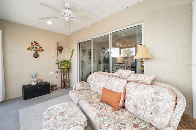 living room with wooden ceiling and ceiling fan