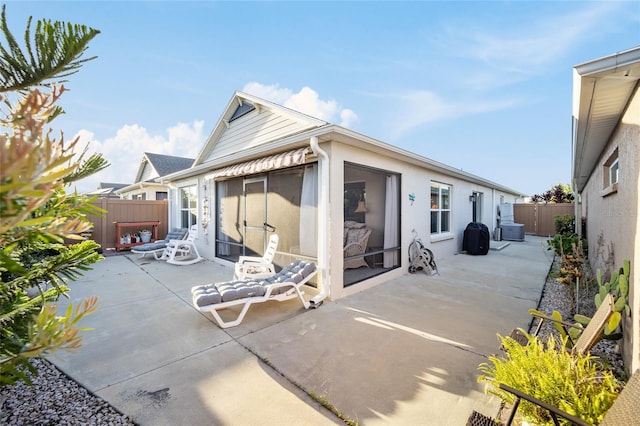 rear view of house with a patio