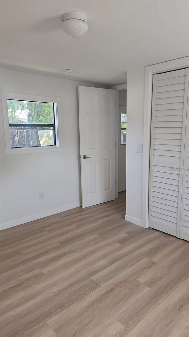 unfurnished bedroom featuring light hardwood / wood-style flooring