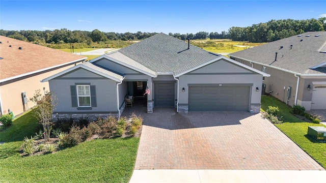 view of front of house featuring a front lawn and a garage