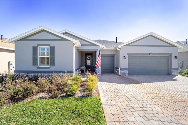 single story home featuring a garage