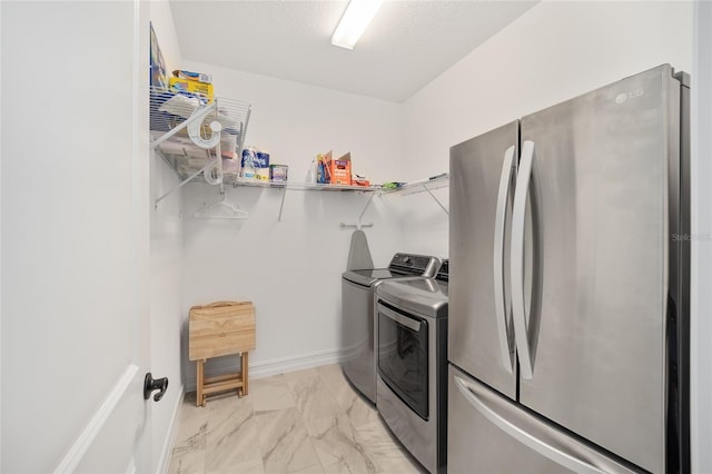 laundry area with washer and dryer