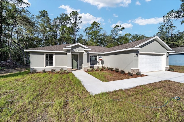 single story home featuring a garage and a front lawn