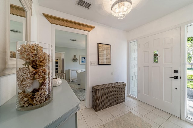 foyer featuring light tile patterned flooring