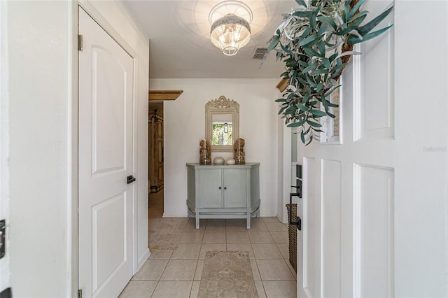 corridor with light tile patterned floors