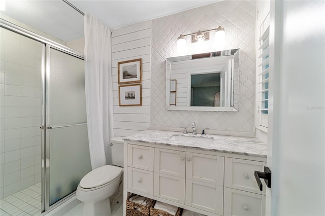 bathroom with toilet, walk in shower, and vanity