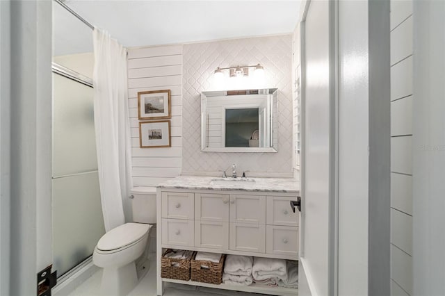 bathroom with vanity, toilet, walk in shower, and decorative backsplash