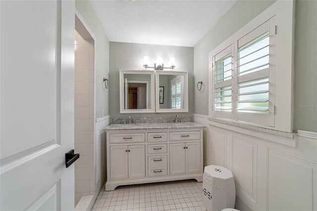 bathroom with vanity and tile patterned flooring