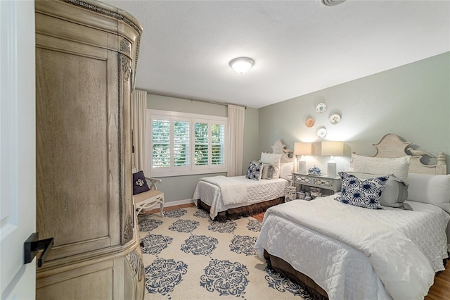 bedroom featuring a textured ceiling