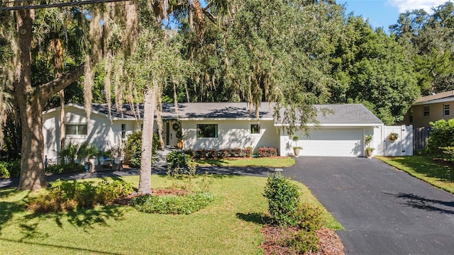 view of front facade featuring a front yard and a garage