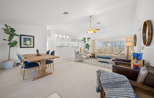 carpeted living room featuring high vaulted ceiling and ceiling fan