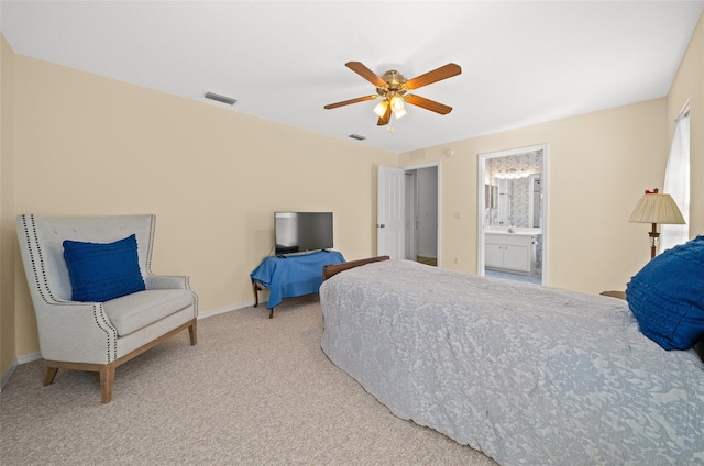 carpeted bedroom with connected bathroom and ceiling fan