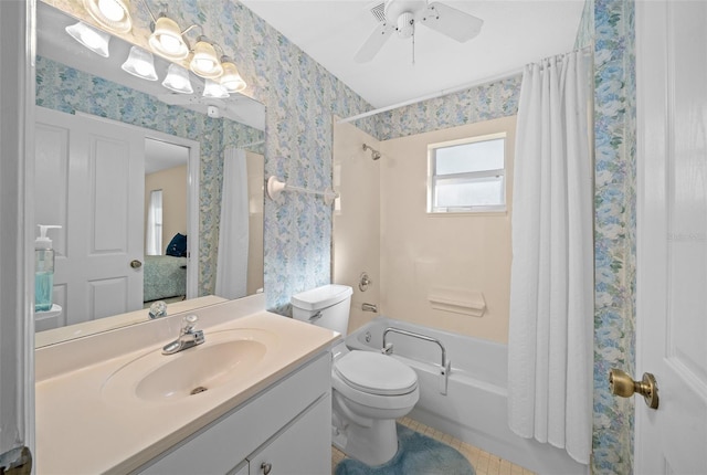 full bathroom with ceiling fan, toilet, shower / bath combo with shower curtain, vanity, and tile patterned flooring