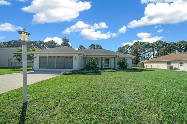 ranch-style house with a front lawn and a garage