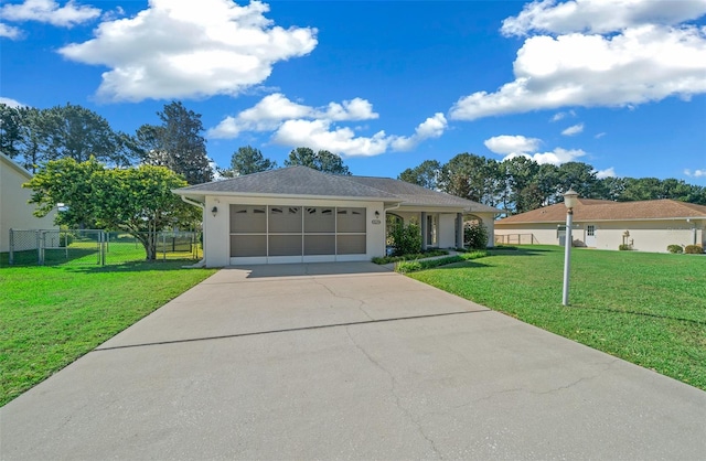 single story home with a front yard and a garage