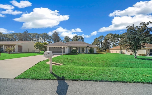 single story home with a front lawn and a garage