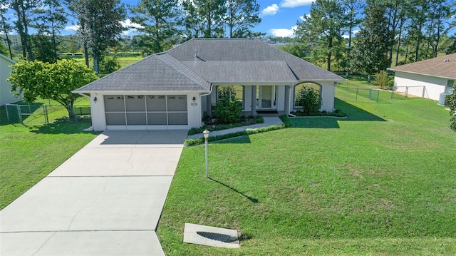 ranch-style home with a front yard and a garage