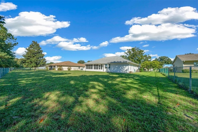 view of yard with a sunroom