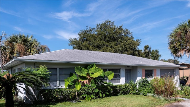 ranch-style home with a front yard