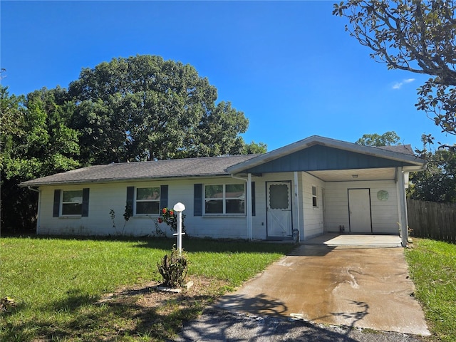 single story home featuring a front yard and a carport