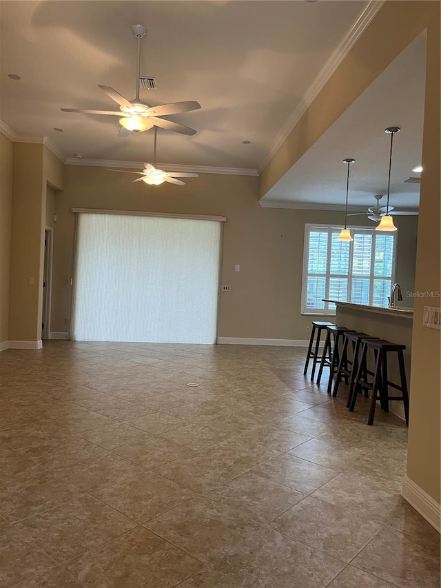 tiled living room featuring ornamental molding and ceiling fan